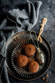 Three coffee muffins with cocoa powder