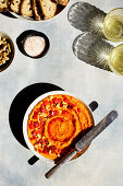 A bowl of homemade red roasted pepper pesto in the sunshine