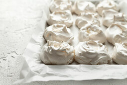 Baked meringues on a piece of white baking paper