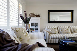 Beige-and-white striped sofa in classic living room