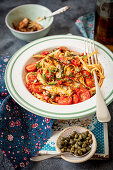 Spaghetti with tomatoes, sardines and capers