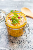 Pumpkin soup with lupine meal (minced meat substitute), parsley and dried edible flowers