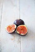 Fresh figs on a white wooden background