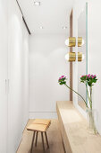 Dressing table on partition wall of walk-in wardrobe in bedroom