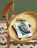 Pebble paperweight decorated with macrame