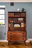 Retro dresser against blue wall