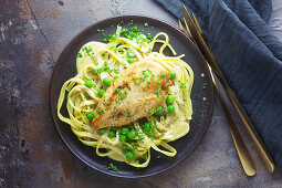 Chicken breast with tagliatelle and peas