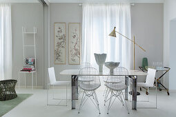 White table and classic chairs in front of window in dining area