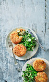 Smoked haddock and herb fishcakes with watercress and pea salad