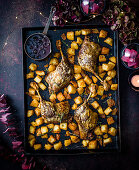 Roast duck with crispy potatoes and mulled-wine cherry sauce