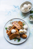 Warm pineapple wedges with pistachio sugar, rum butter and vanilla flavoured ice cream