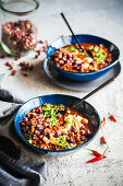 Smoky chilli con carne with crispy bambara groundnuts