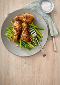 Crunchy buttermilk chicken drumsticks with asparagus and almonds