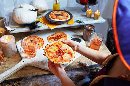 Homemade halloween spider pizzas