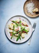 Asparagus gnocchi with garlic butter and prosciutto crumbs