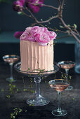 Sparkling rosé and strawberry cake with flowers