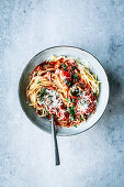 Spaghetti with tomatoes, spinach and a white wine sauce