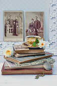 Roses and coffee cup on old books