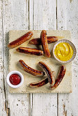 BBQ sausages with mustard and ketchup