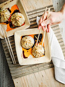 Pan-fried soup dumplings (sheng jian bao)