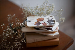 Stack of handmade scented wax tablets with flowers and leaves