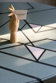 Old blue wooden table decorated with black washi tape