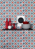 Kitchen utensils on shelf on graphic blue-and-red wallpaper