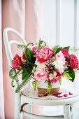 Pink and white floral bouquet with roses, peonies and fern leaves