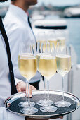 A waiter serving champagne