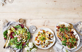 Green salad with pickled grapes, Warm potato salad with cheesy sauce and Festive slaw