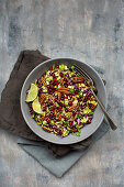 Red cabbage salad with pecan nuts, lime and pomegranates