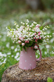 Bouquet of lilies of the valley and apple blossoms