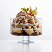 Trifle with soft amaretti, chocolate sauce, custard and cream