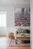 Opium table in living room with stucco ceiling and panelled wall