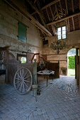 Chandelier and candelabra on table in old stable