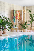 Swimming pool decorated in Urban Jungle style with houseplants