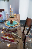 Cakes on rustic, festively set wooden table