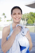 A brunette woman after a workout