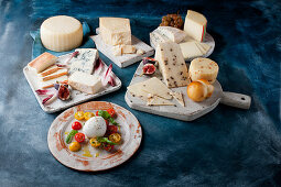 Antipasti: Various types of cheese with fruit and with tomatoes