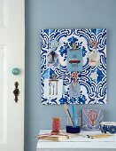 Handmade key rack covered in blue-and-white wallpaper with Azulejo pattern