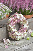 Autumn wreath of hydrangea flowers, sedum, and snowberries