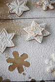 Snowflake cookies with powdered sugar on a wooden table