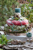 Homemade moss wreath cake with a candle in the middle