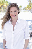 A long-haired woman wearing white shirt