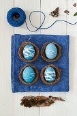 Blue Easter eggs in small baskets