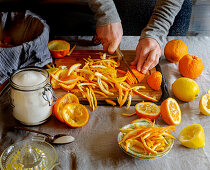 Preparing orange jam: cutting the orange peel into strips