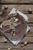 Twigs of blackthorn blossom tied to cutlery decorating place setting