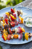 Grilled vegetable kebabs with a herb and quark dip