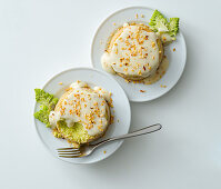 Romanesco flans with cheese sauce, honey and hazelnuts