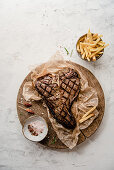 Grilled t-bone steak with chips